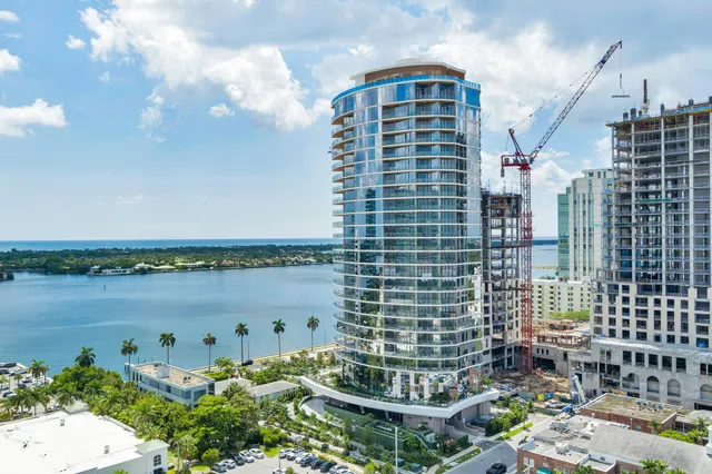 a view of a lake and tall building