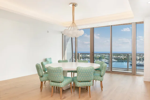 a view of a dining room with furniture window and outside view