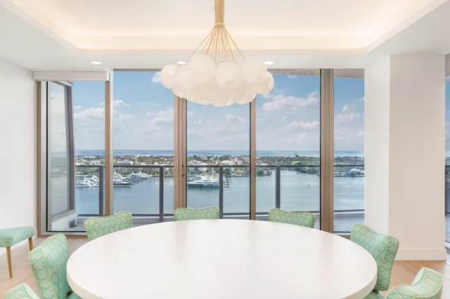 a very nice looking dining room with a large window