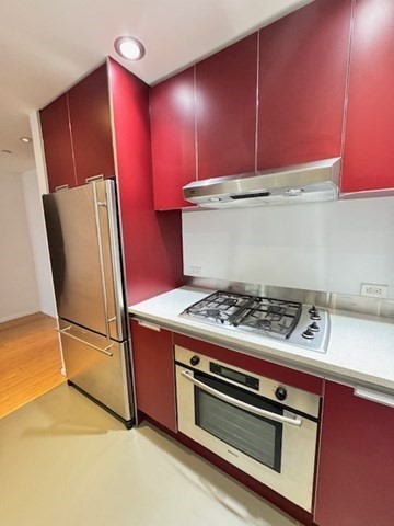 141 Dorchester Avenue, Unit 806 Boston, MA 02127 - Photo 2 of 12 a stove top oven sitting inside of a kitchen
