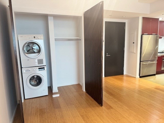 141 Dorchester Avenue, Unit 806 Boston, MA 02127 - Photo 6 of 12 a view of a kitchen with a refrigerator washer and a sink