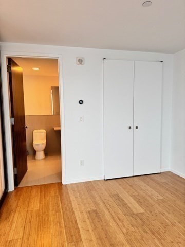 141 Dorchester Avenue, Unit 806 Boston, MA 02127 - Photo 8 of 12 a view of a bedroom with a hardwood and hallway