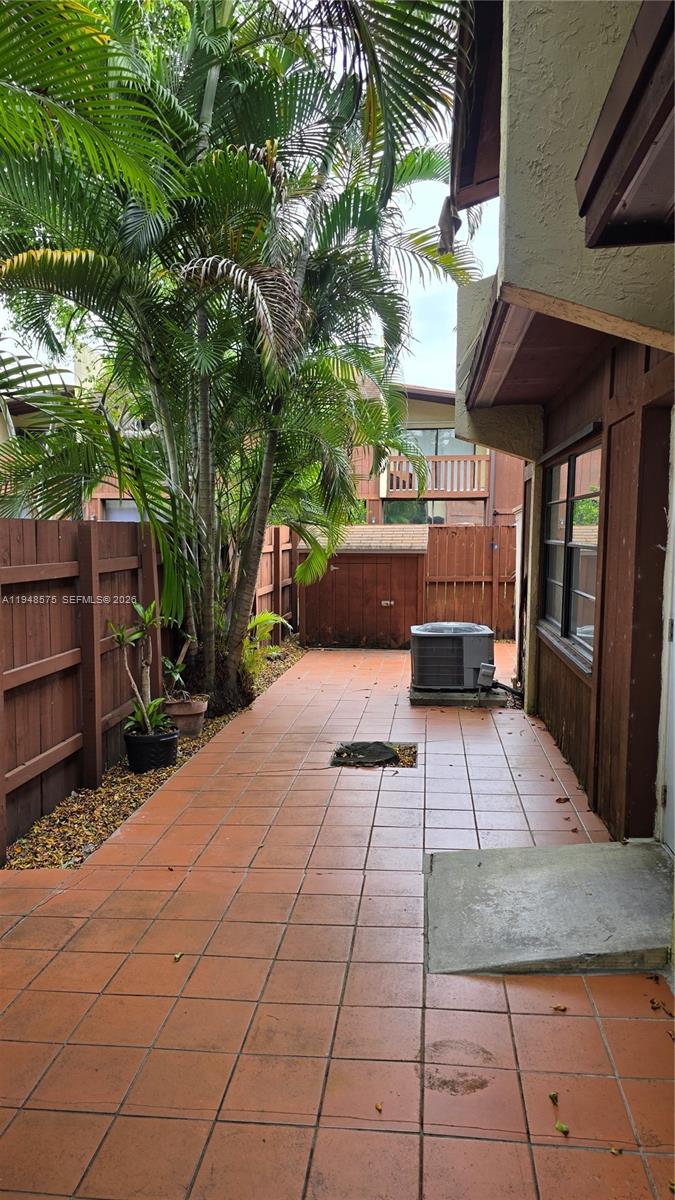 7124 Southwest 114th Place, Unit A Miami, FL 33173 - Photo 17 of 19 a view of outdoor space deck and tree