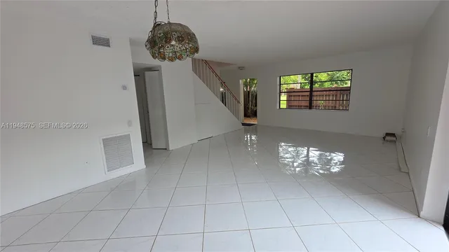 a view of entryway with kitchen