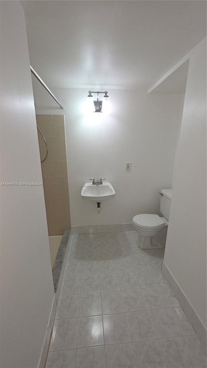 7124 Southwest 114th Place, Unit A Miami, FL 33173 - Photo 7 of 19 a bathroom with a toilet