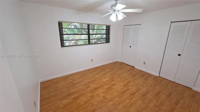 a view of empty room with windows