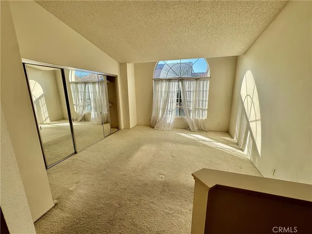 a view of a room with large windows