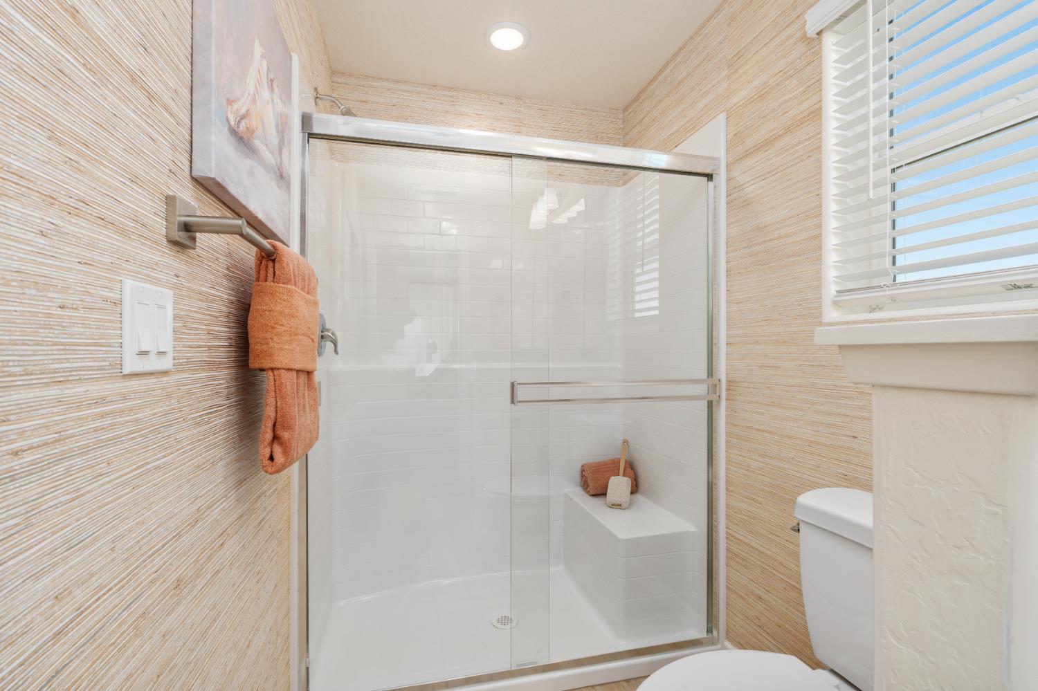 1489 Farmhouse Lane Clovis, CA 93619 - Photo 28 of 33 a bathroom with a shower and a toilet