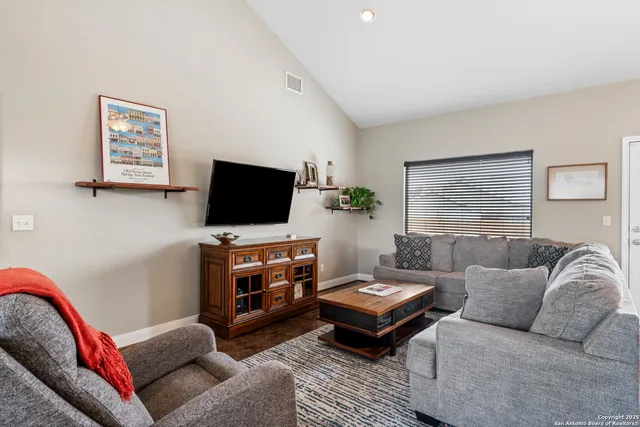 a kitchen with stainless steel appliances granite countertop a kitchen island a stove a table and chairs