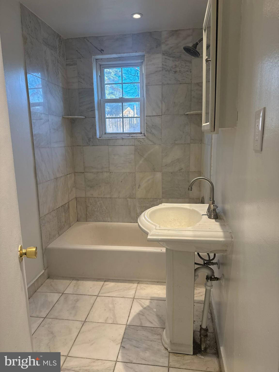 210 Trinity Avenue, Unit A1 Ambler, PA 19002 - Photo 8 of 8 a bathroom with a sink a bathtub and shower