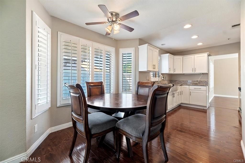 16444 Trelaney Road Fontana, CA 92337 - Photo 8 of 21 a view of a dining room with furniture window and wooden floor