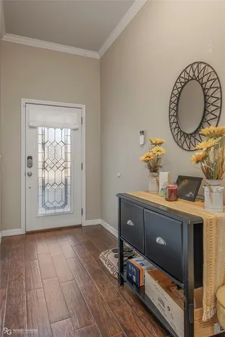 a view of room with window and wooden floor