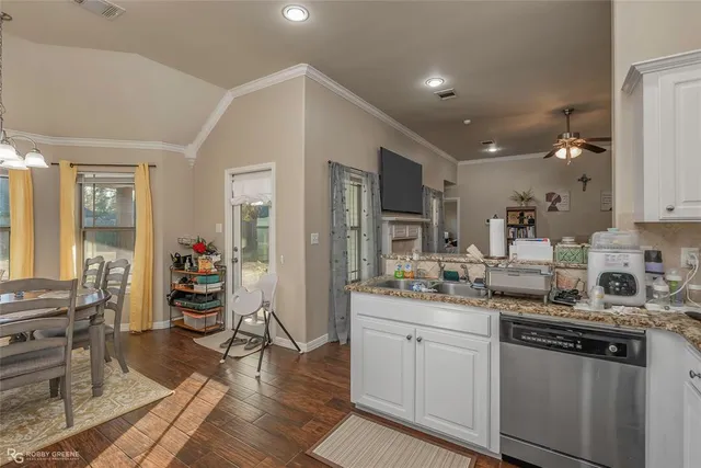 a kitchen with counter top space and cabinets