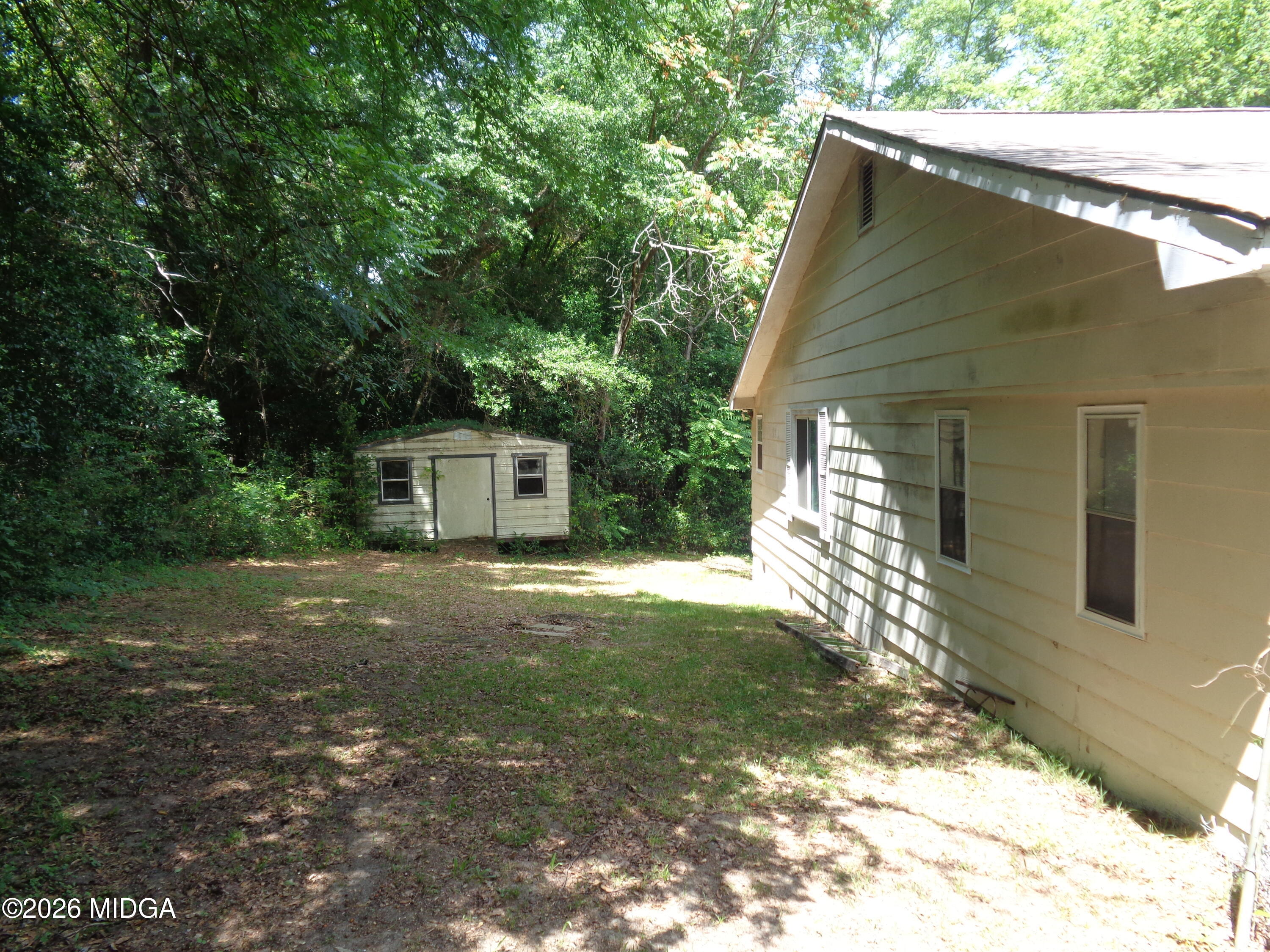 3380 Goodwin Lane Macon, GA 31217 - Photo 20 of 22 a backyard of a house with table and chairs