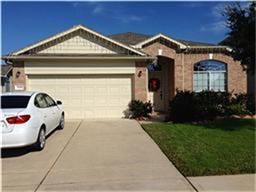 25202 Diamond Ranch Drive Katy, TX 77494 - Photo 11 of 13 a front view of a house with garden