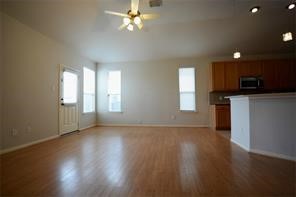 25202 Diamond Ranch Drive Katy, TX 77494 - Photo 3 of 13 an empty room with wooden floor and windows
