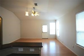 25202 Diamond Ranch Drive Katy, TX 77494 - Photo 4 of 13 an empty room with wooden floor and windows