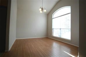 25202 Diamond Ranch Drive Katy, TX 77494 - Photo 5 of 13 a view of an empty room with wooden floor and a window