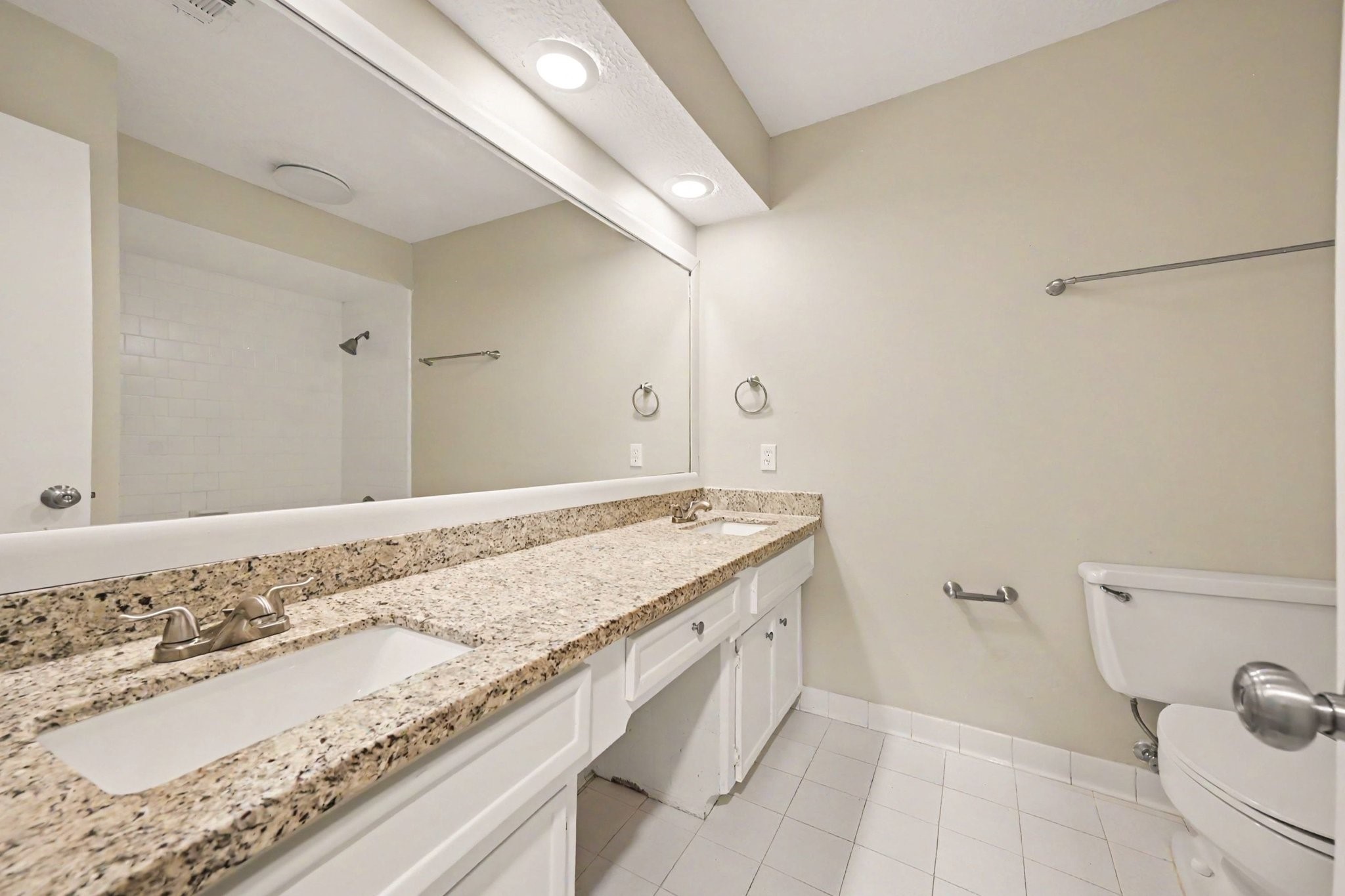 17419 Cassina Drive Spring, TX 77388 - Photo 29 of 35 a bathroom with a granite countertop sink and a mirror