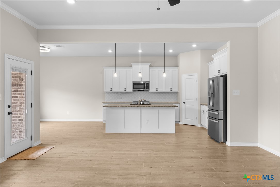 3405 Waggoner Drive Belton, TX 76513 - Photo 17 of 48 a large kitchen with a refrigerator a sink and a stove