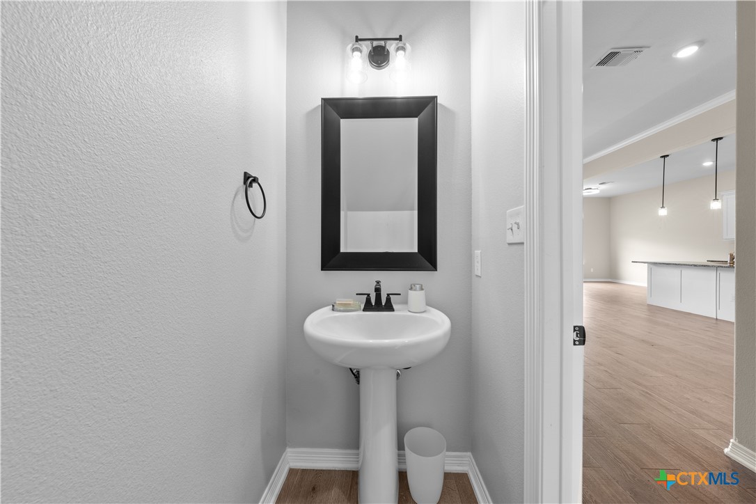 3405 Waggoner Drive Belton, TX 76513 - Photo 34 of 48 a bathroom with a sink and a mirror