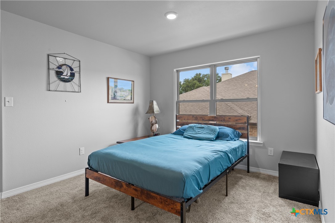 3405 Waggoner Drive Belton, TX 76513 - Photo 37 of 48 a bedroom with a bed and a window