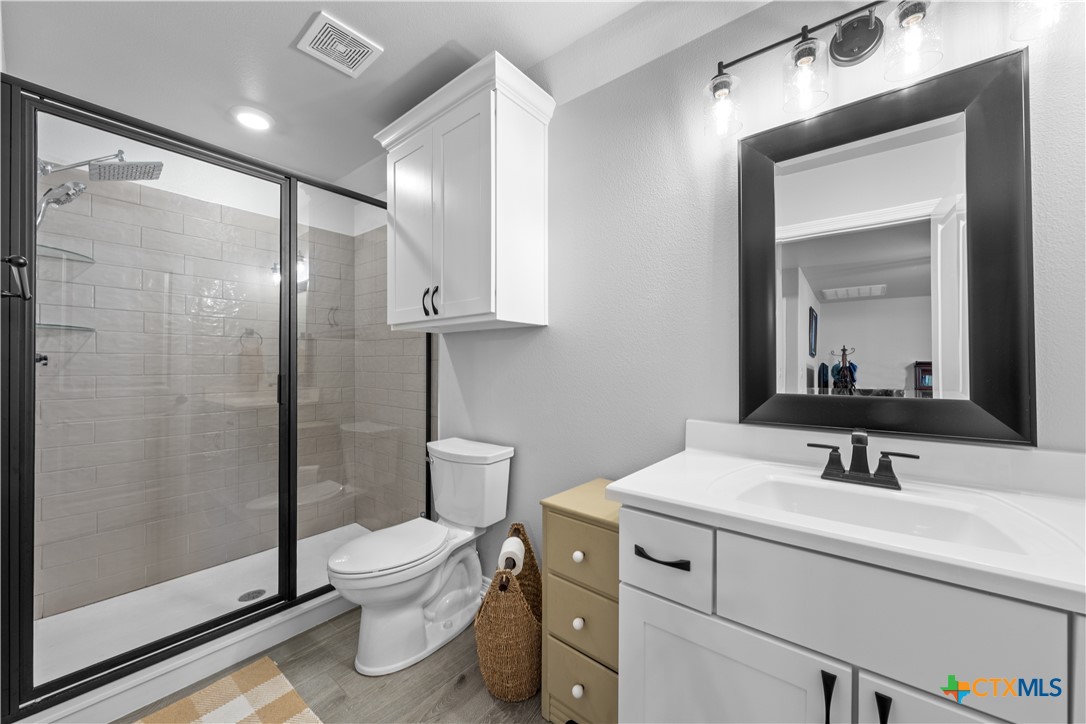 3405 Waggoner Drive Belton, TX 76513 - Photo 39 of 48 a bathroom with a toilet sink and shower