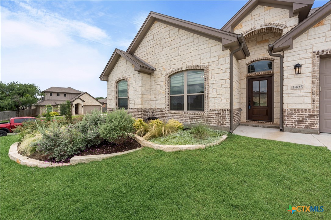 3405 Waggoner Drive Belton, TX 76513 - Photo 5 of 48 a view of a house with a yard patio and a garden