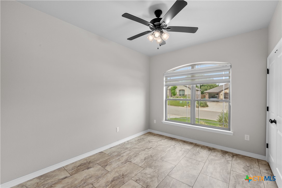 3405 Waggoner Drive Belton, TX 76513 - Photo 8 of 48 an empty room with windows and fan