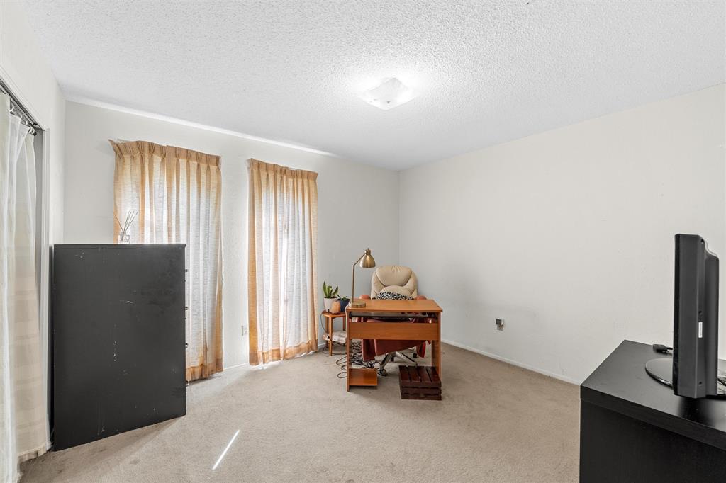 300 Travis Lane Hewitt, TX 76643 - Photo 13 of 18 a living room with furniture and a flat screen tv