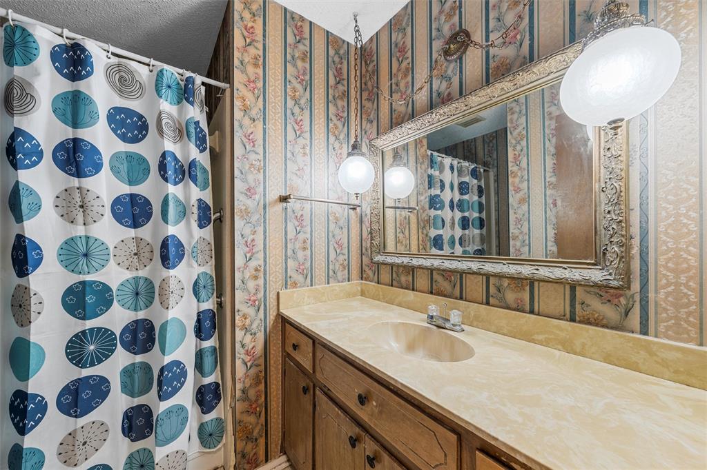 300 Travis Lane Hewitt, TX 76643 - Photo 15 of 18 a bathroom with a sink and a mirror