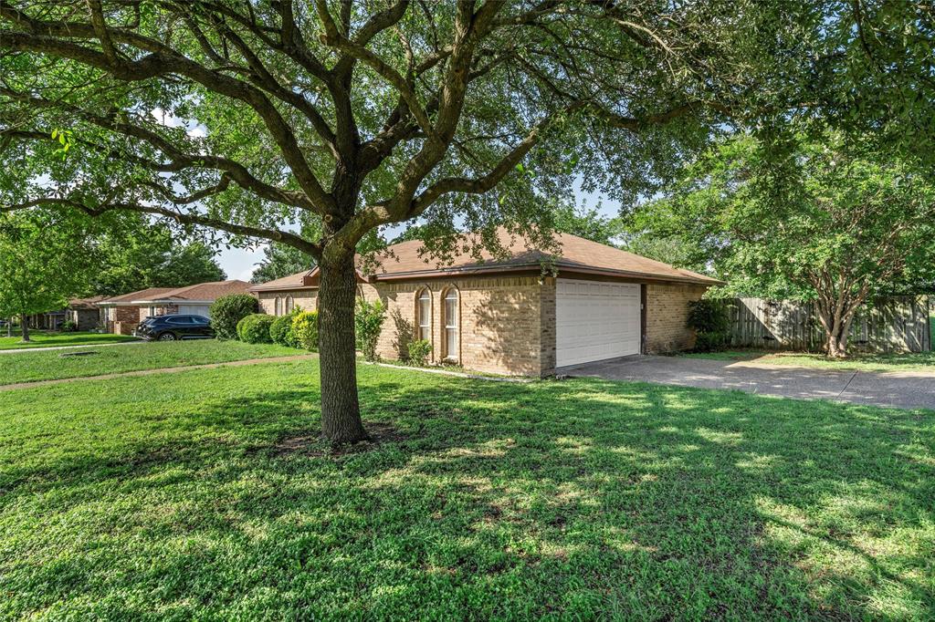 300 Travis Lane Hewitt, TX 76643 - Photo 2 of 18 a view of a house with yard and tree s