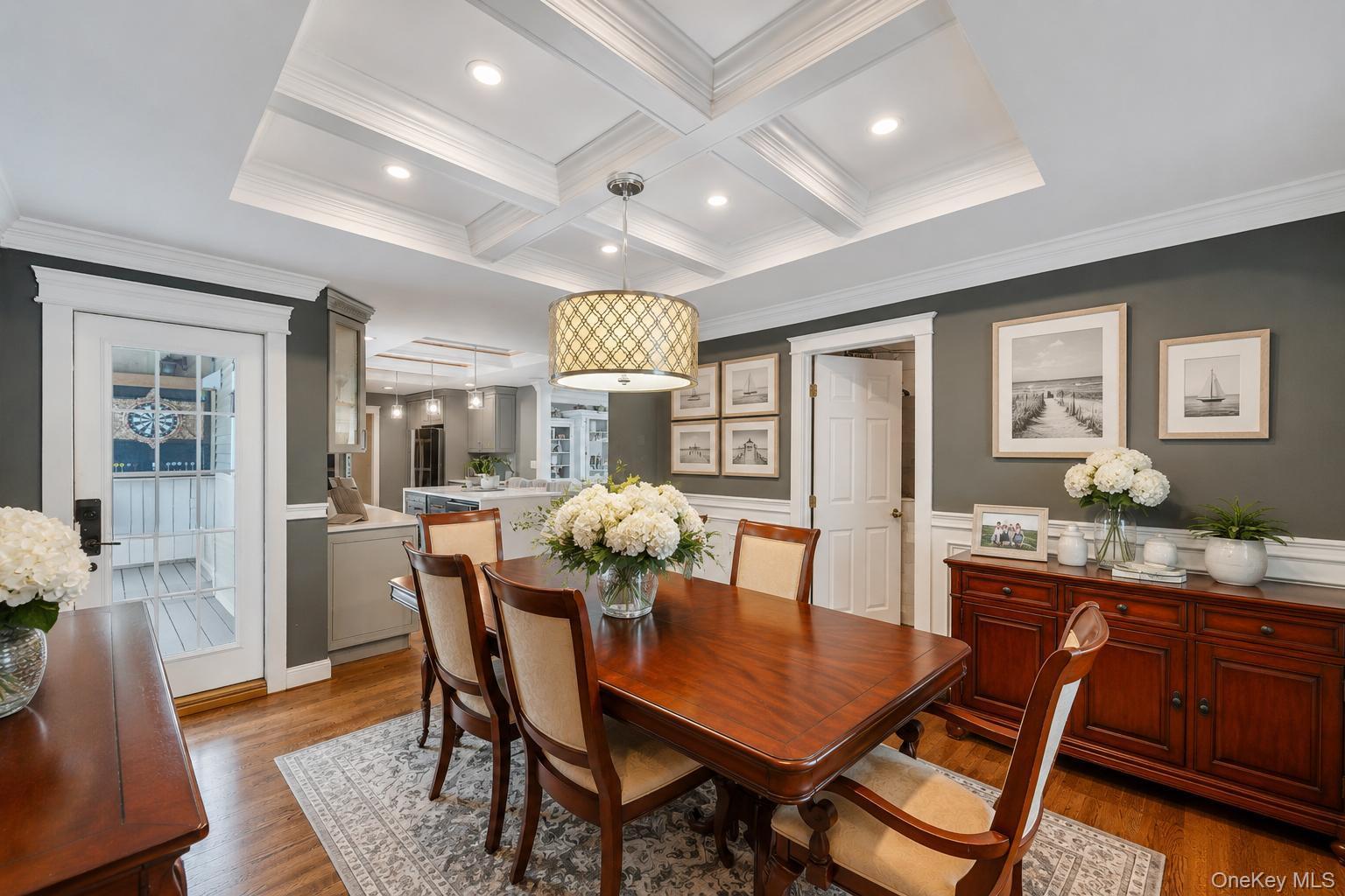 19 Joan Road Bay Shore, NY 11706 - Photo 15 of 50 Dining area featuring a coffered ceiling, recessed lighting, and wood-finish flooring