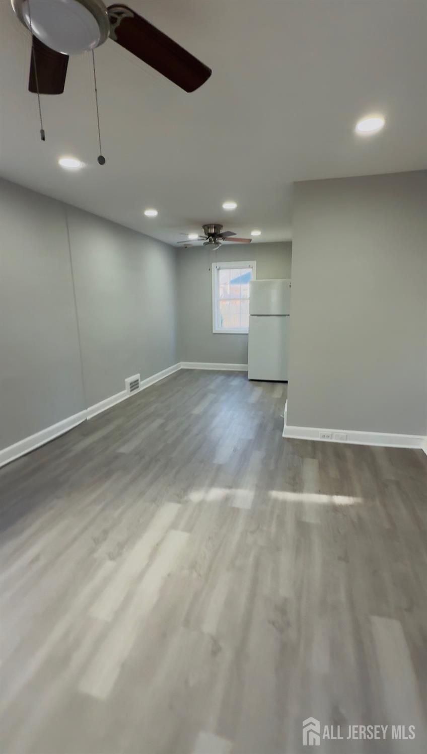 42 MacArthur Drive Edison, NJ 08837 - Photo 2 of 10 an empty room with windows