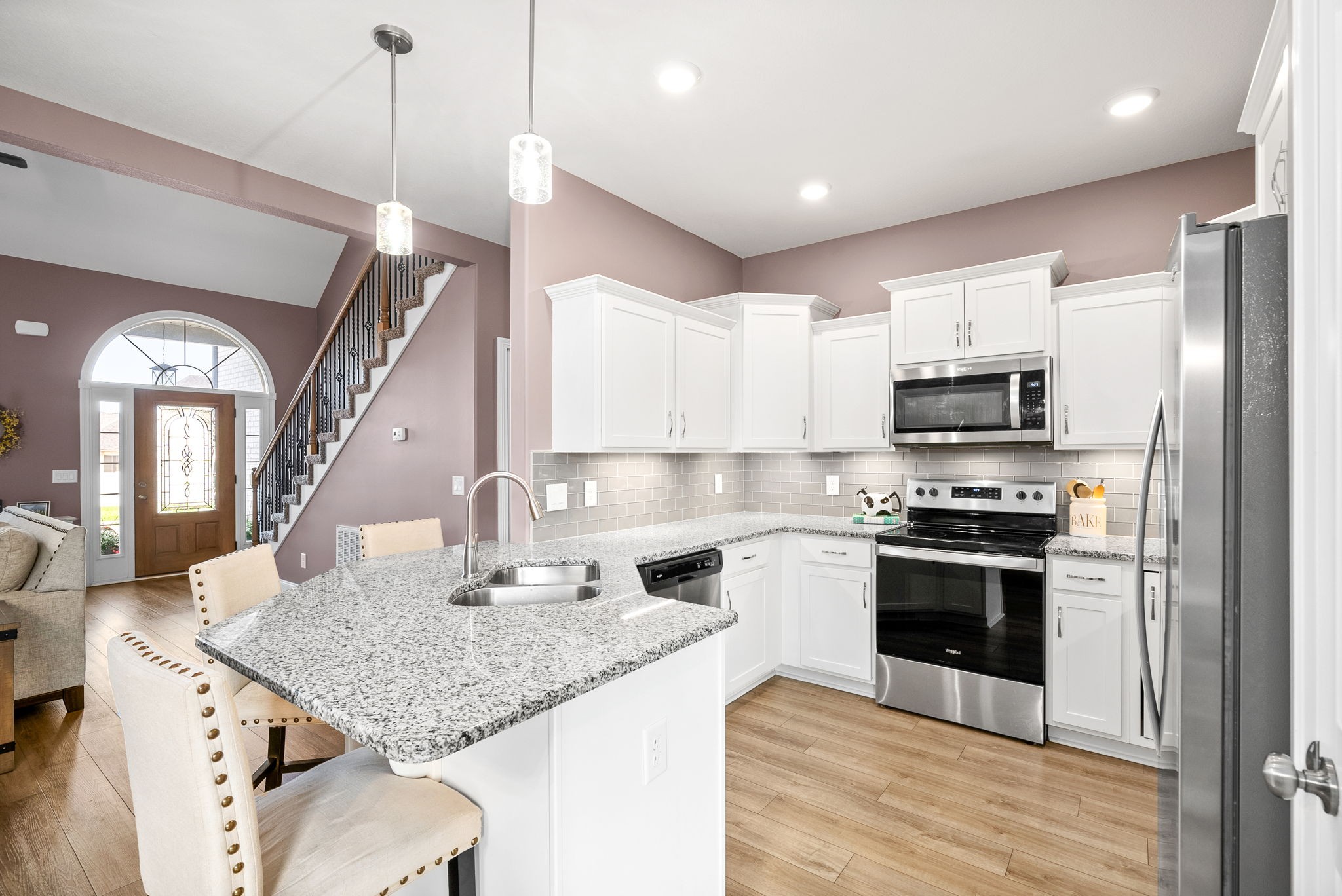 2251 Allen-Griffey Road Clarksville, TN 37042 - Photo 13 of 31 a kitchen with stainless steel appliances granite countertop a kitchen island hardwood floor sink and stove