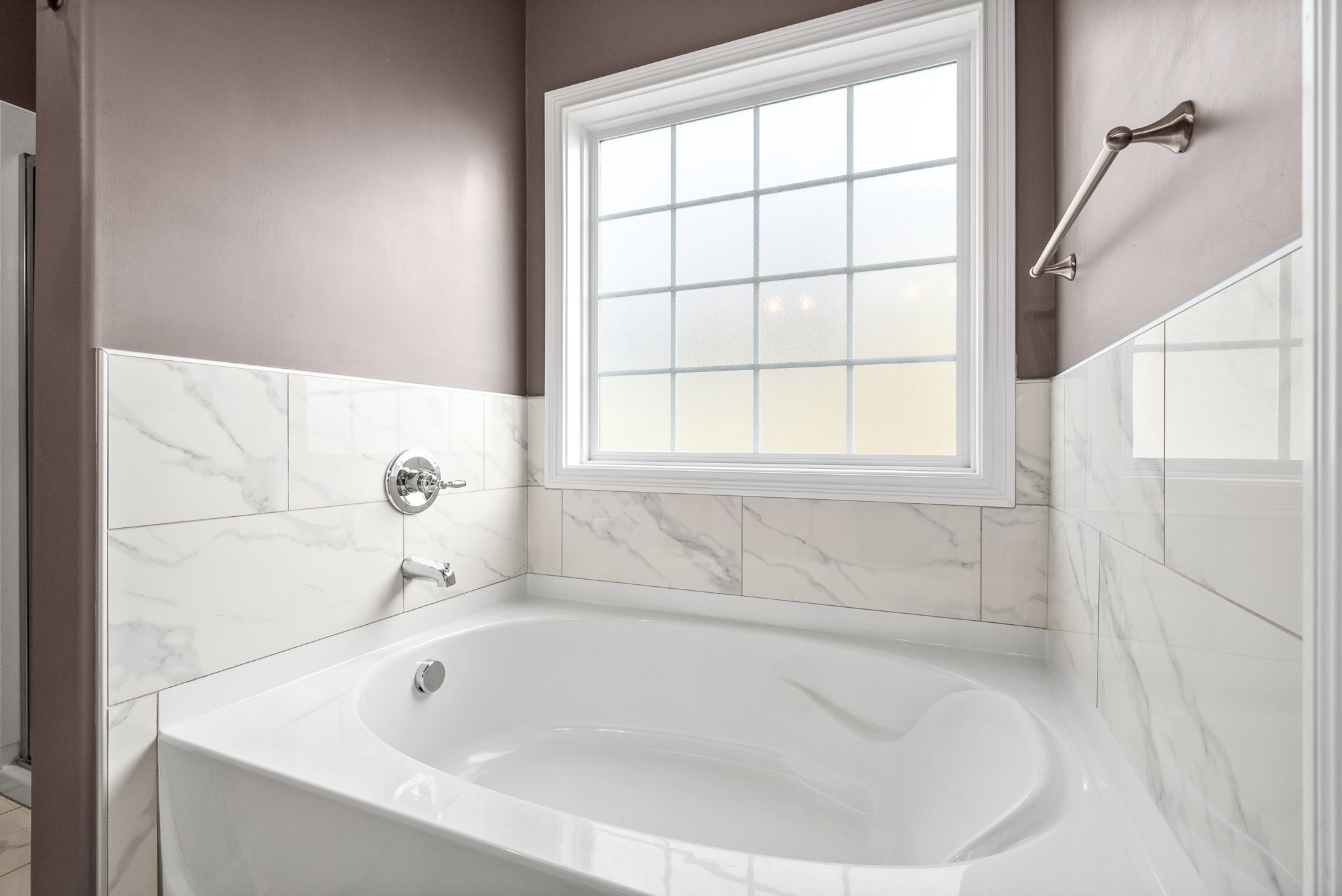 2251 Allen-Griffey Road Clarksville, TN 37042 - Photo 21 of 31 a white bath tub sitting next to a window