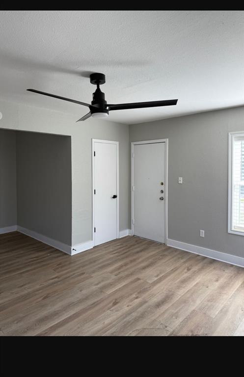 219 Southeast 13th Street, Unit 4 Grand Prairie, TX 75051 - Photo 2 of 5 a view of an empty room with a window