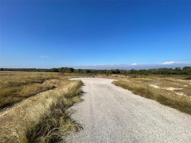 a view of a lake with houses in the background