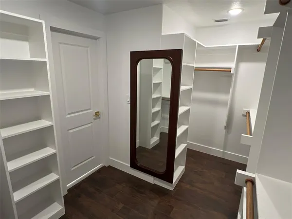 a view of an entryway with wooden floor