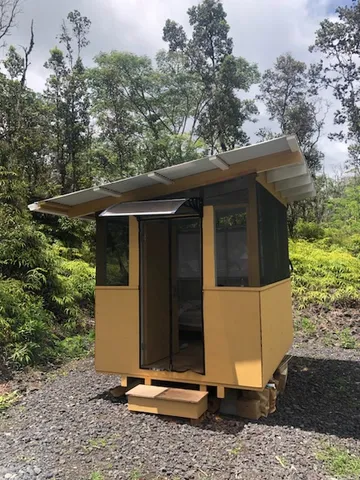 a side view of a house with a yard