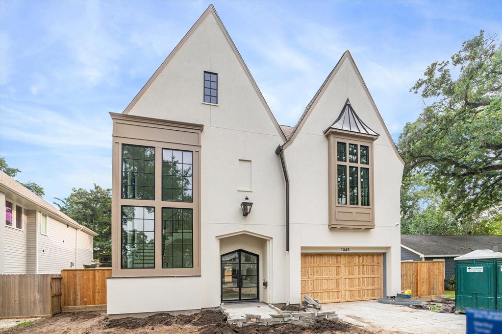 A Garden Oaks showplace by Arch Angelo Homes.The blend of soft, neutral tones perfectly combine for outstanding curb appeal. This home is scheduled for completion for June 2024 and it promises to be extraordinary! Photo as of 5/9/2024