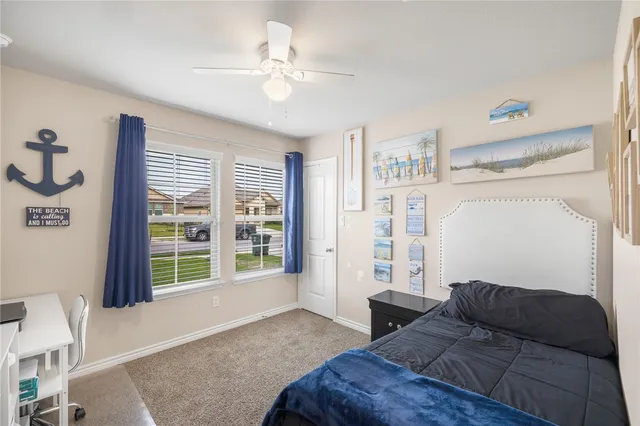 a bathroom with a granite countertop toilet and a shower