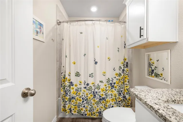 a bedroom with bed and a window