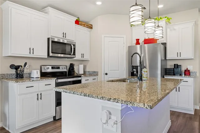 a dining room with furniture a window and a chandelier