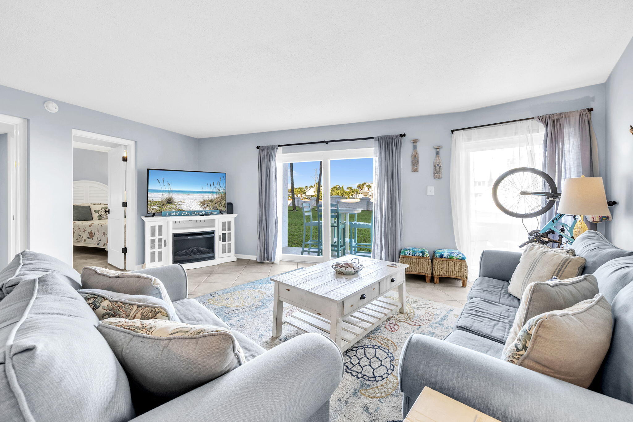 909 Santa Rosa Boulevard, Unit 515 Fort Walton Beach, FL 32548 - Photo 14 of 49 a living room with furniture fireplace and a large window