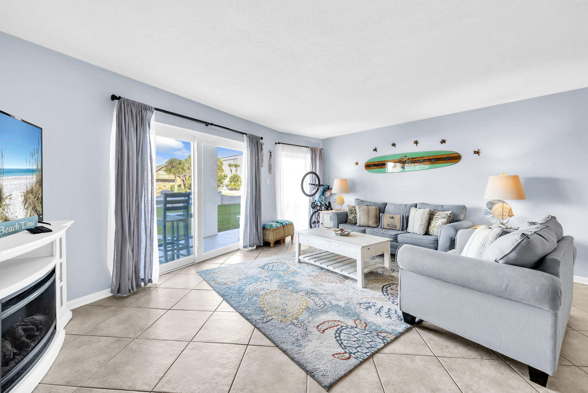 909 Santa Rosa Boulevard, Unit 515 Fort Walton Beach, FL 32548 - Photo 15 of 49 a living room with furniture and a fireplace