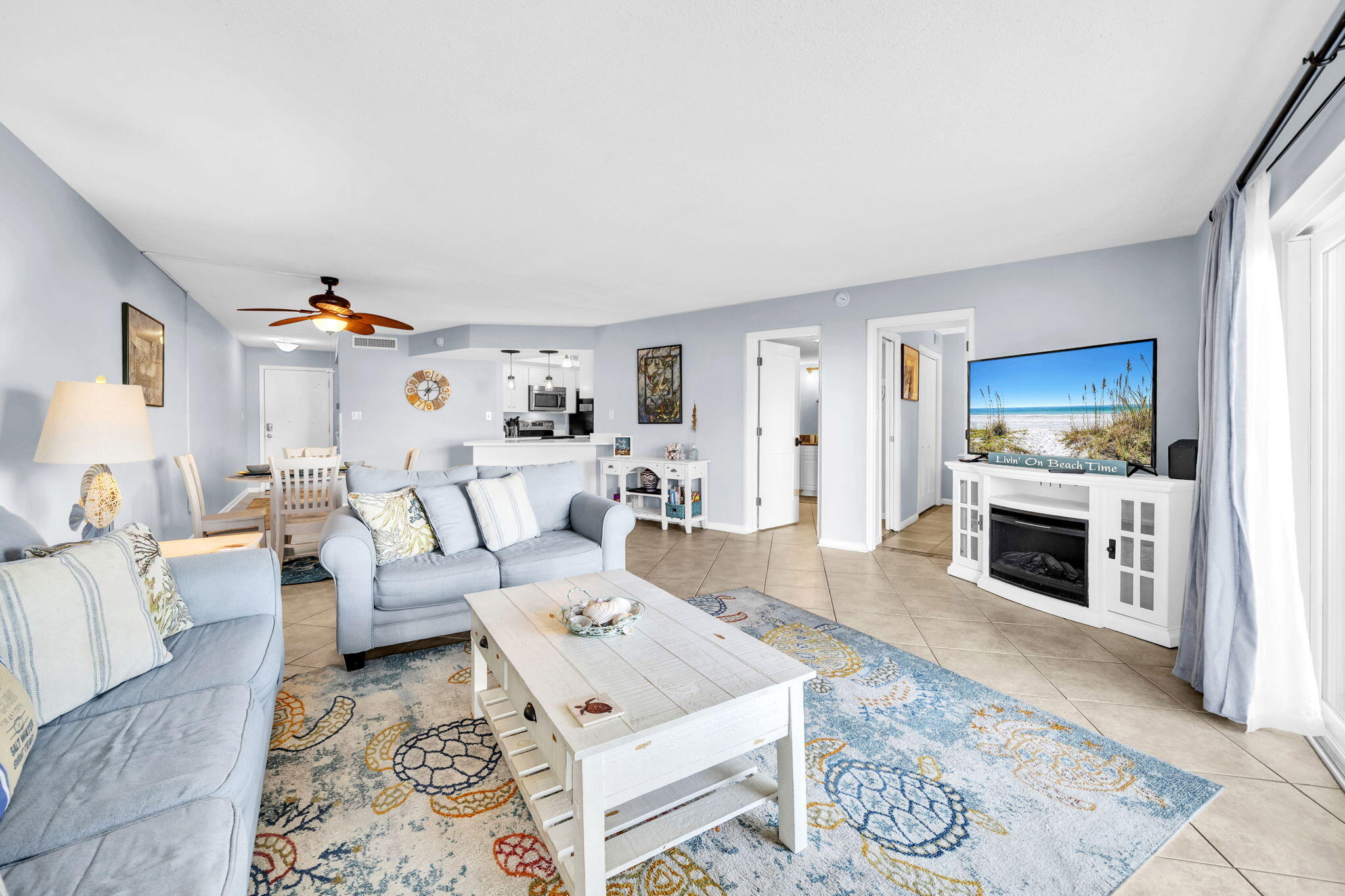 909 Santa Rosa Boulevard, Unit 515 Fort Walton Beach, FL 32548 - Photo 19 of 49 a living room with furniture fireplace and flat screen tv