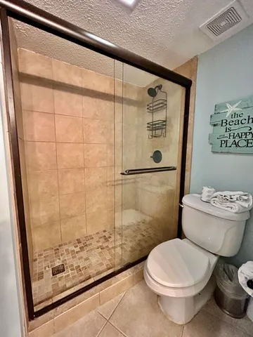 a bedroom with a bed and cabinets