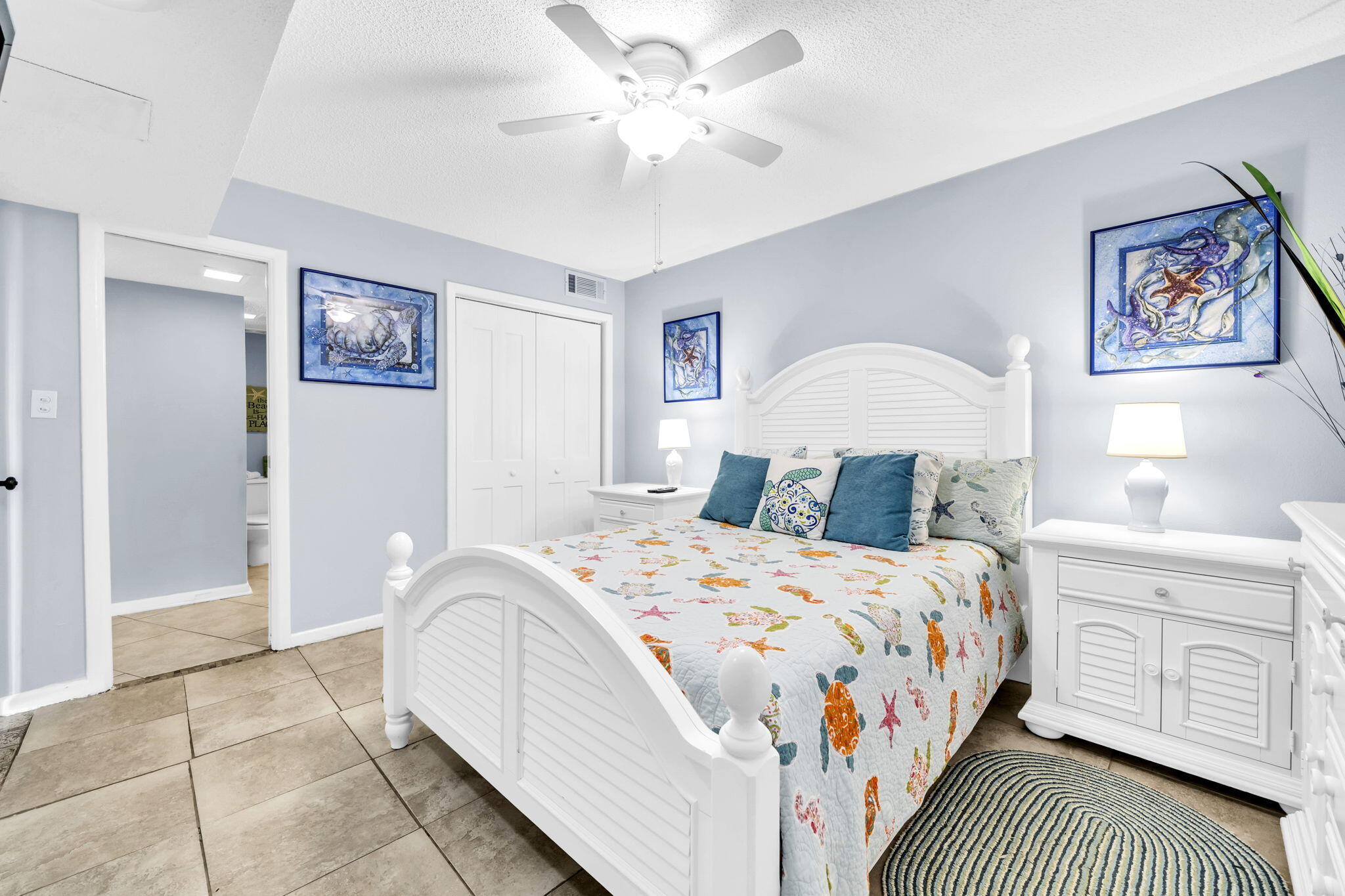 909 Santa Rosa Boulevard, Unit 515 Fort Walton Beach, FL 32548 - Photo 21 of 49 a bedroom with a bed a dresser and painting on the wall