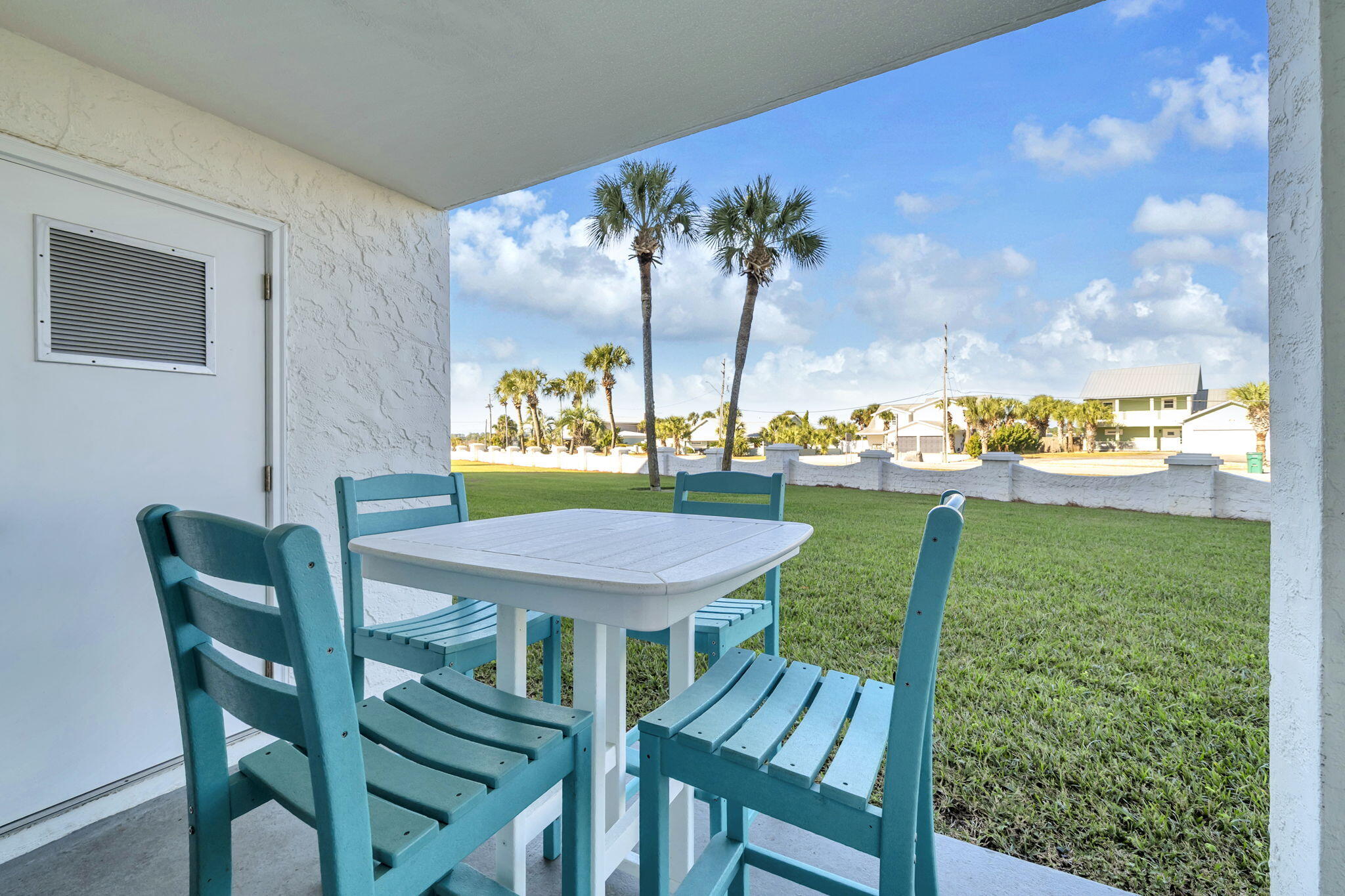 909 Santa Rosa Boulevard, Unit 515 Fort Walton Beach, FL 32548 - Photo 24 of 49 a view of a dining room with furniture a chandelier and wooden floor